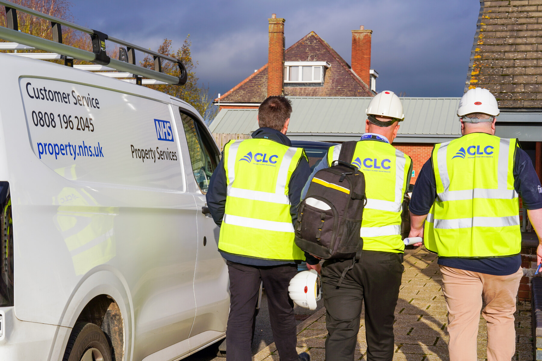 Three CLC workers walking